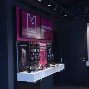 Modernes Telekom-Shop-Interior mit Smartphone-Ausstellung und Werbedisplays für MagentaEINS.